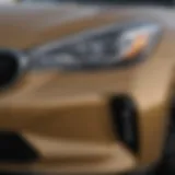 Close-up view of a used AWD Kia Stinger's sleek headlights