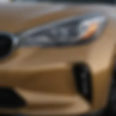 Sleek Headlights of the Kia Stinger Close-up view of a used AWD Kia Stinger's sleek headlights