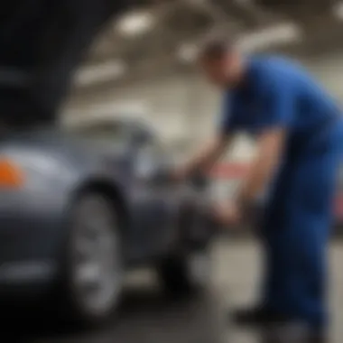 An experienced mechanic inspecting a used car under the hood