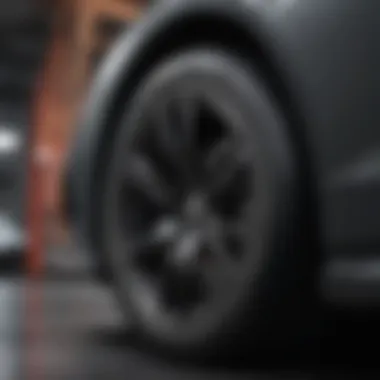 Close-up view of a high-performance tire on a modern car rim.