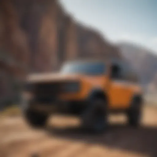 The iconic silhouette of the Bronco Defender against a rugged landscape